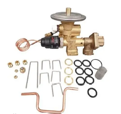 Danfoss Service Kit mit verschiedenen Ventilen, Unterlegscheiben, O-Ringen und anderen Komponenten, die für Wartungs- und Reparaturarbeiten an Heizsystemen verwendet werden.
